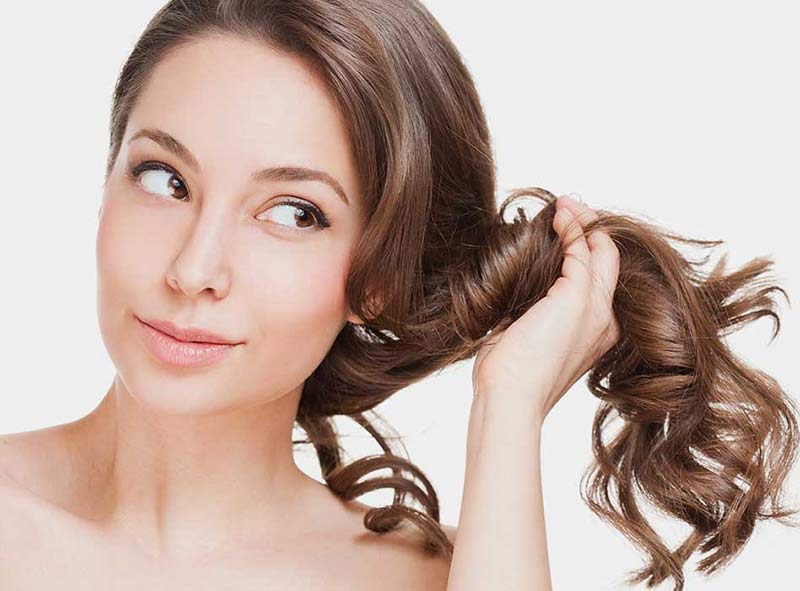 What are the common causes of hair loss in women?